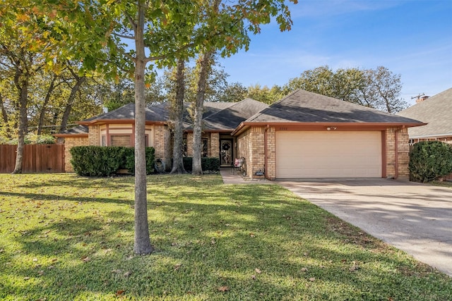 ranch-style house featuring a front yard and a garage