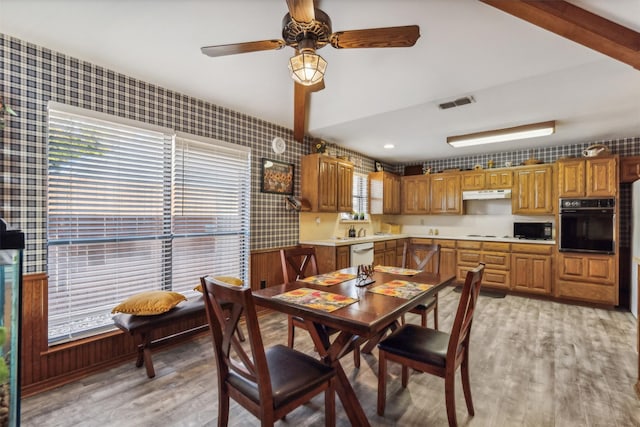 dining area featuring light hardwood / wood-style floors and ceiling fan