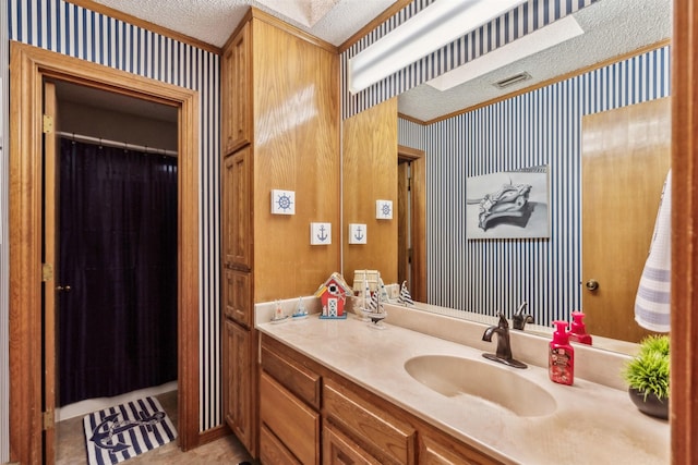 bathroom featuring vanity and a textured ceiling