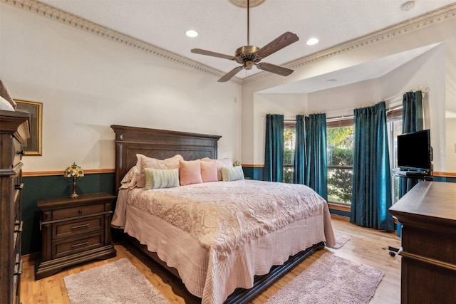 bedroom with ceiling fan and light hardwood / wood-style floors