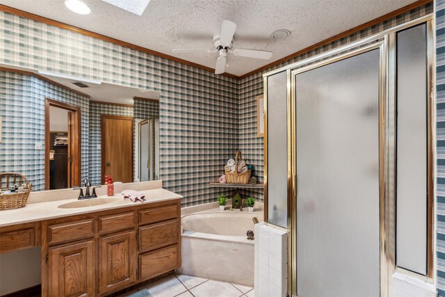 bathroom featuring vanity, a textured ceiling, tile patterned floors, and separate shower and tub