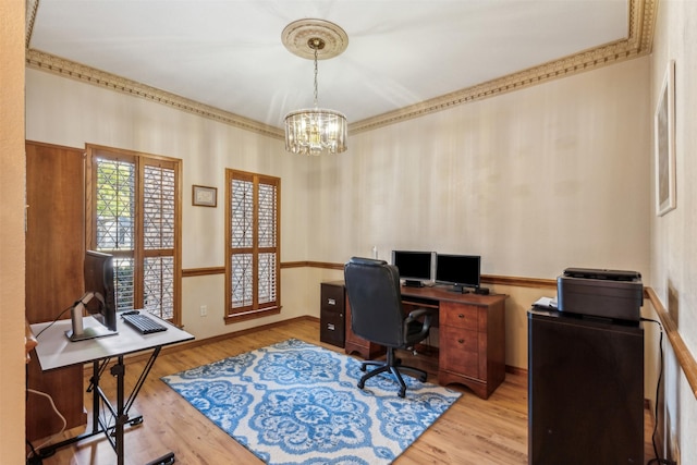 office featuring an inviting chandelier and light hardwood / wood-style flooring