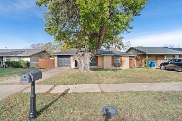 ranch-style house with a front yard and a garage