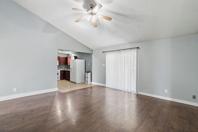 unfurnished living room with light wood-type flooring, high vaulted ceiling, and ceiling fan