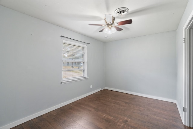 unfurnished room with ceiling fan and dark hardwood / wood-style flooring