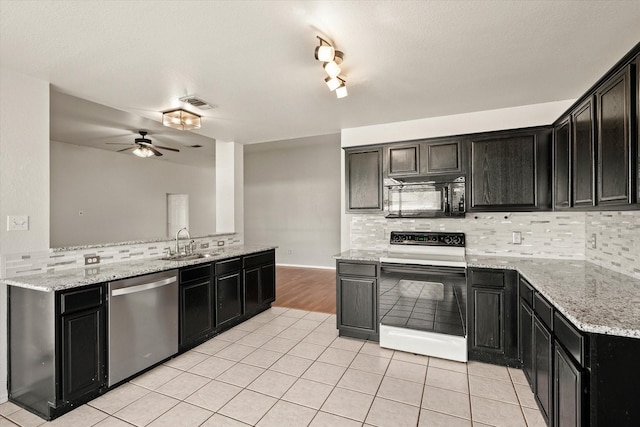 kitchen featuring sink, white electric stove, stainless steel dishwasher, ceiling fan, and light tile patterned floors