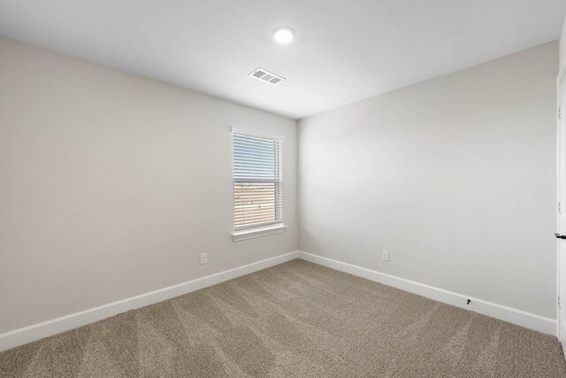 spare room featuring carpet floors