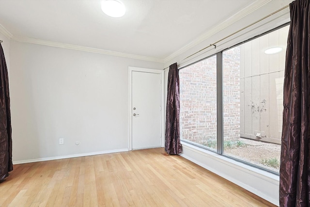 unfurnished room featuring light hardwood / wood-style flooring and ornamental molding