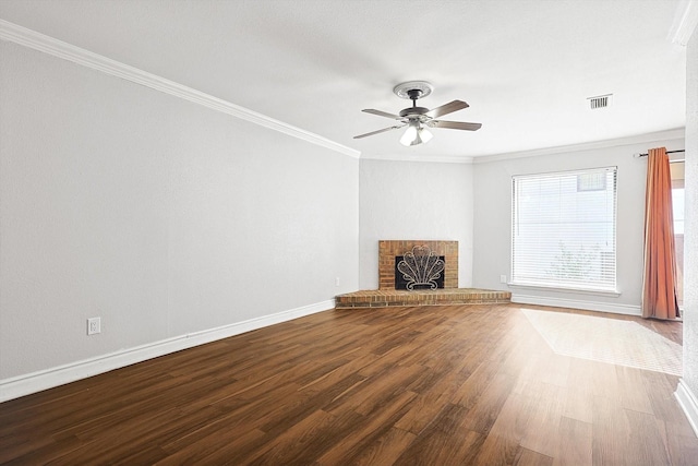 unfurnished living room featuring crown molding, ceiling fan, wood-type flooring, and a brick fireplace