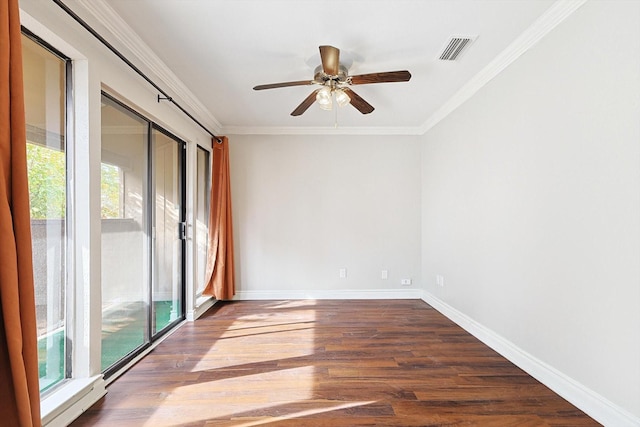 spare room featuring a wealth of natural light, ceiling fan, and hardwood / wood-style flooring