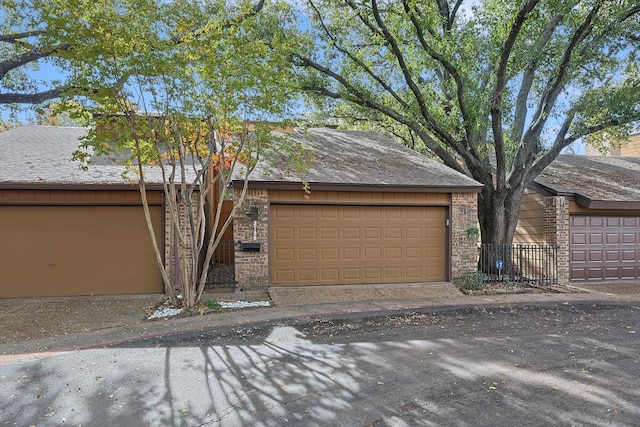 single story home featuring a garage