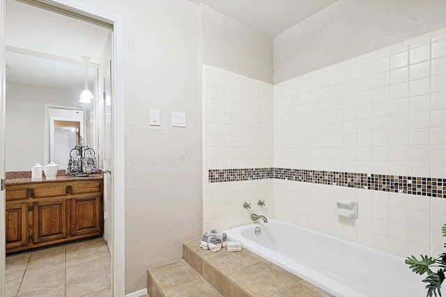 bathroom featuring tile patterned flooring and a relaxing tiled tub