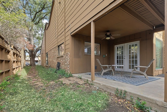 exterior space with ceiling fan and a patio