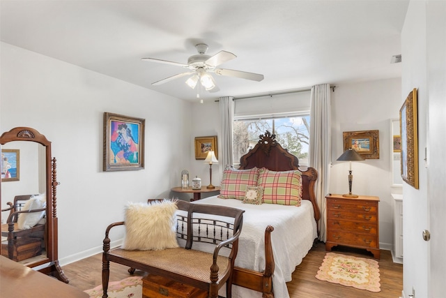 bedroom featuring hardwood / wood-style flooring and ceiling fan