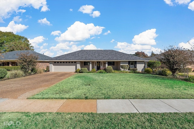 view of front of property with a garage and a front lawn