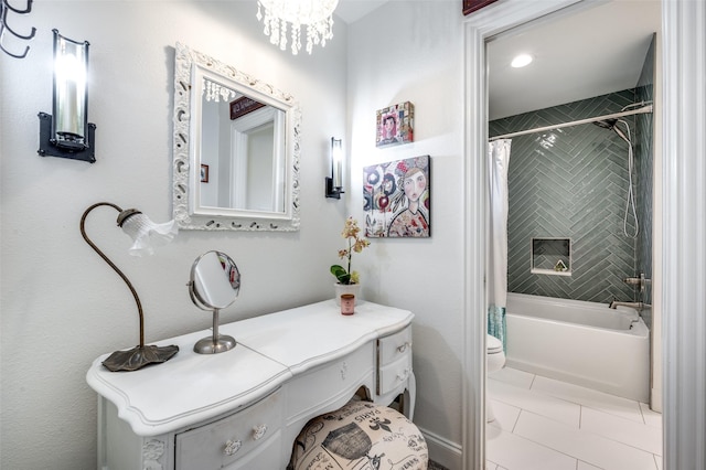 bathroom with tile patterned flooring, shower / bath combination with curtain, and toilet