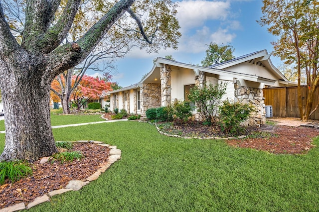 view of home's exterior featuring a lawn and cooling unit