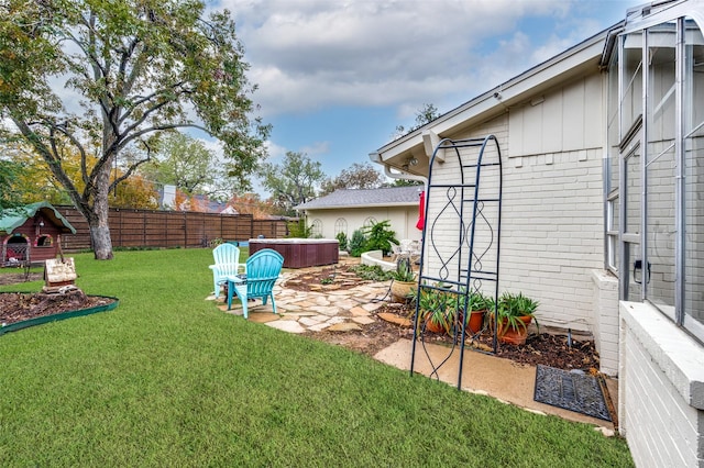 view of yard featuring a patio and a hot tub