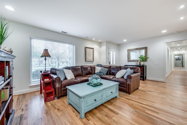 living room with light hardwood / wood-style floors