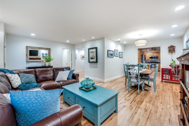 living room with light hardwood / wood-style flooring