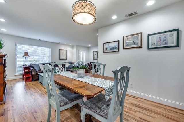 dining area with light hardwood / wood-style floors