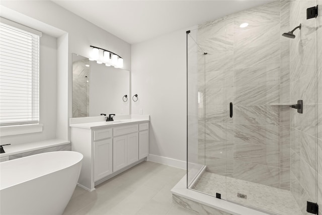 1514 Overton St, Frisco, TX 75036 - bathroom featuring a shower stall, vanity, a soaking tub, and baseboards