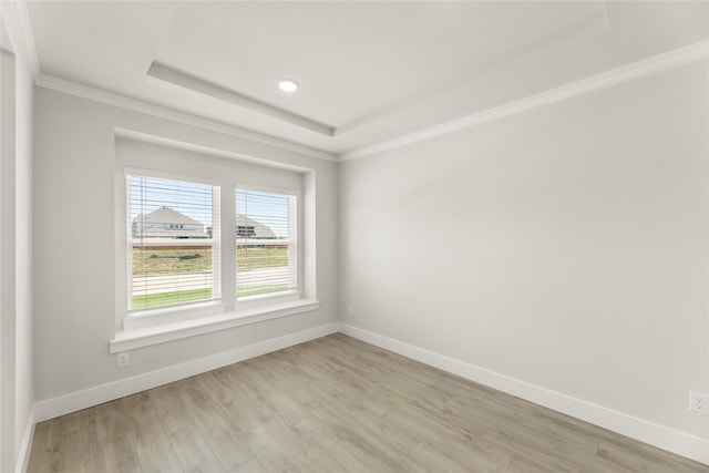 1514 Overton St, Frisco, TX 75036 - unfurnished room featuring light wood-type flooring, ornamental molding, baseboards, a raised ceiling, and recessed lighting