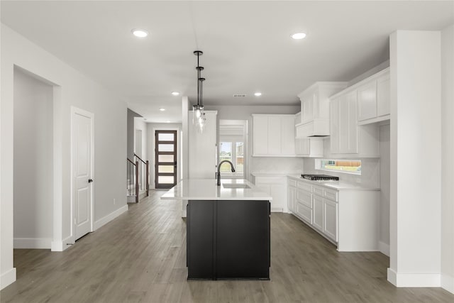 1514 Overton St, Frisco, TX 75036 - kitchen with a sink, recessed lighting, light countertops, baseboards, and light wood-style flooring
