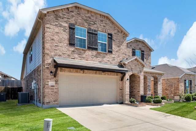 view of front property with a garage, central AC unit, and a front lawn