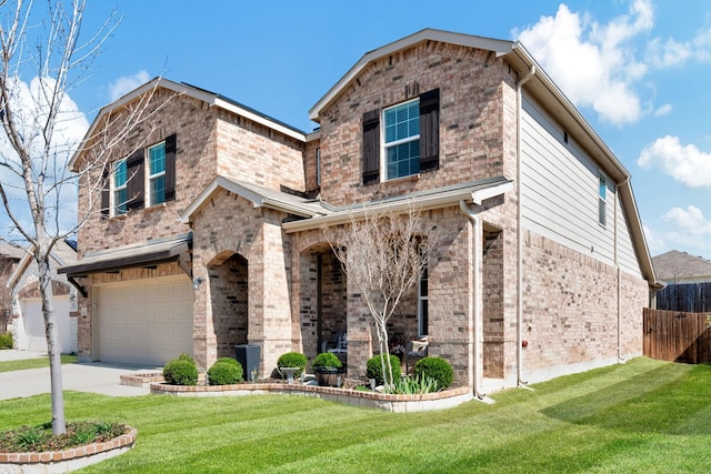 view of front of property featuring a garage and a front lawn