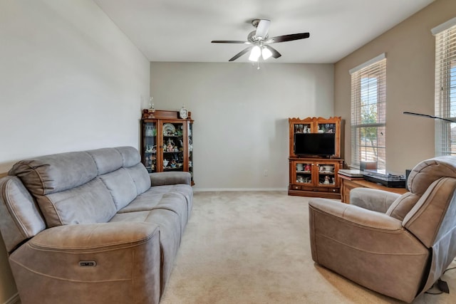 living room featuring ceiling fan and light carpet