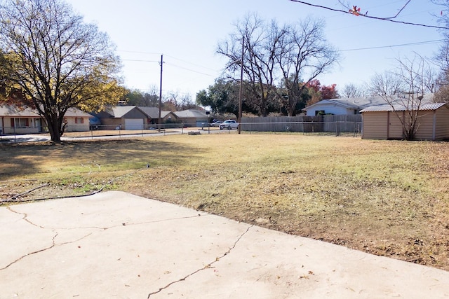 view of yard featuring a patio area and a shed