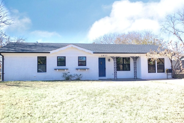 ranch-style house with a front lawn