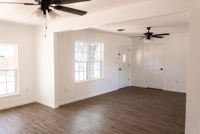 spare room with dark hardwood / wood-style floors and ceiling fan