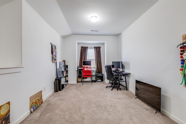 office space with carpet flooring and lofted ceiling