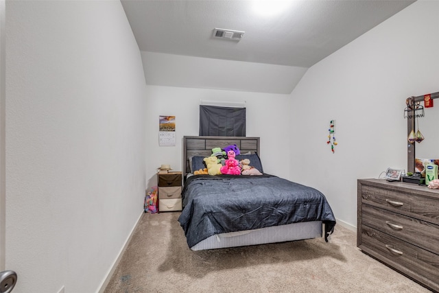 carpeted bedroom featuring vaulted ceiling