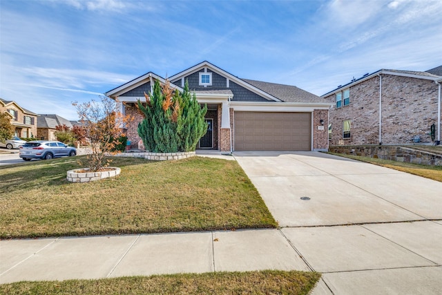 view of front of home featuring a garage and a front lawn