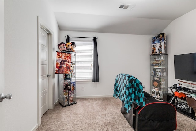 carpeted office space with lofted ceiling