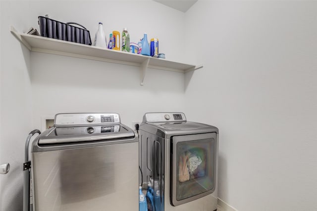 laundry room with independent washer and dryer