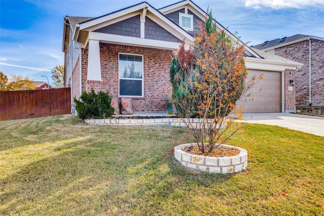 view of front of property with a garage and a front yard