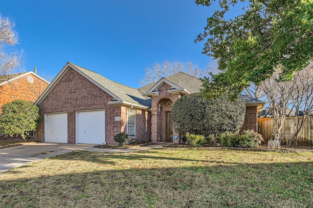 view of front of house with a garage and a front yard