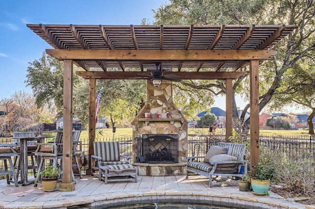 view of patio featuring a pergola, ceiling fan, and an outdoor stone fireplace