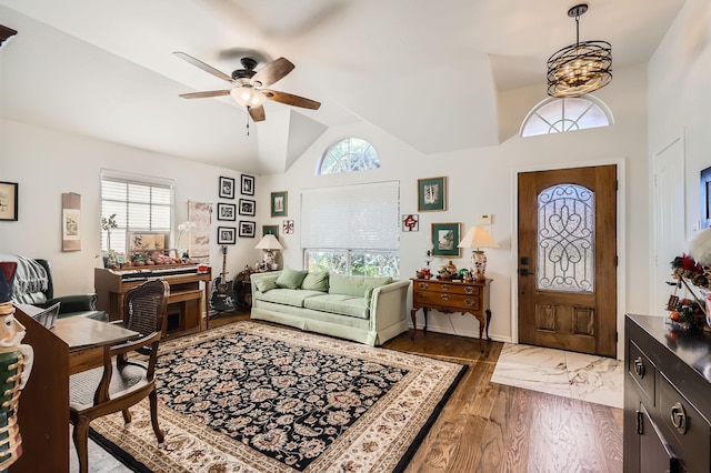 entrance foyer featuring dark hardwood / wood-style flooring, ceiling fan, and lofted ceiling