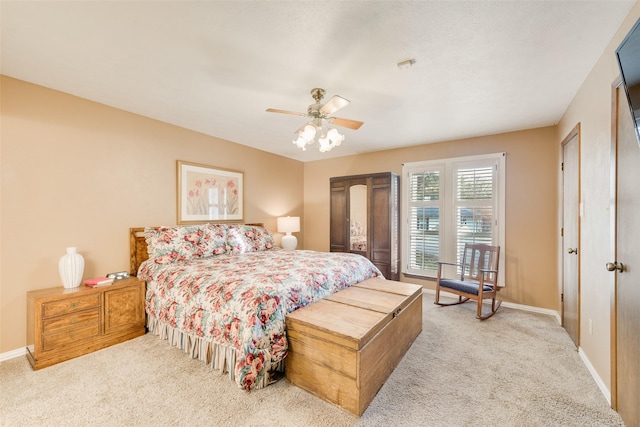 bedroom with light colored carpet and ceiling fan