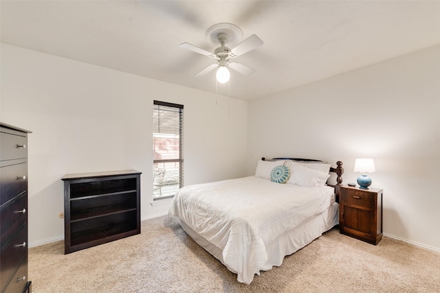 bedroom featuring ceiling fan and light colored carpet