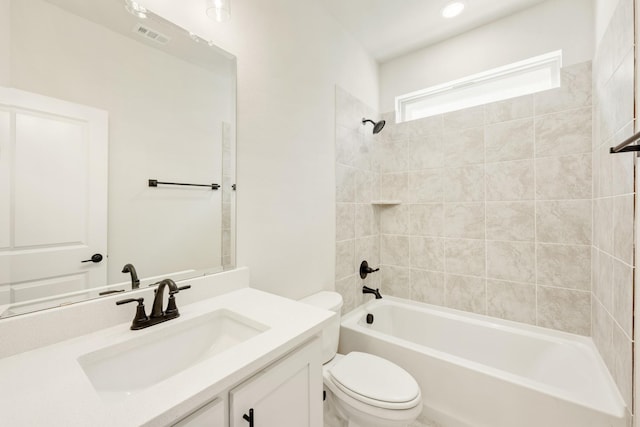 bathroom featuring visible vents, bathing tub / shower combination, vanity, and toilet