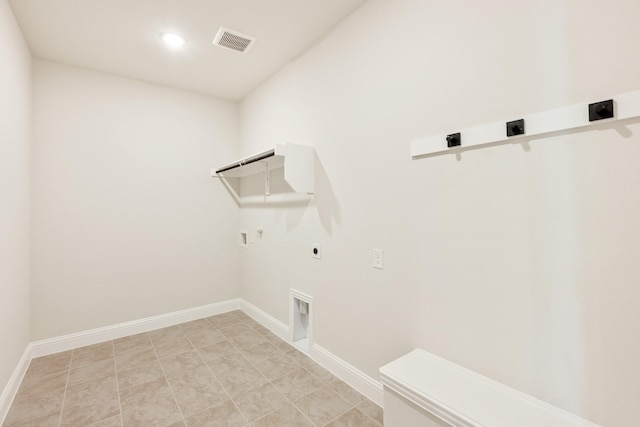 washroom featuring hookup for a gas dryer, hookup for an electric dryer, laundry area, visible vents, and baseboards