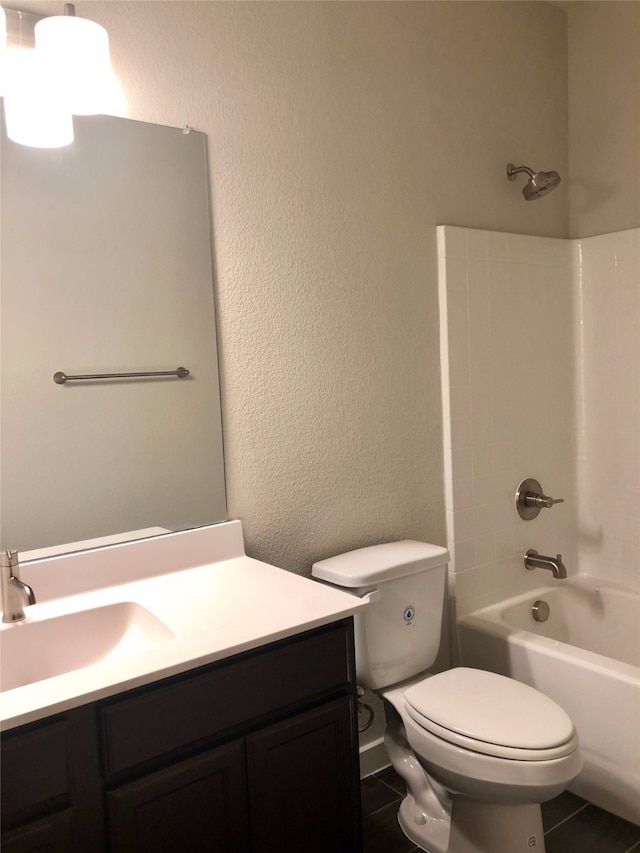 full bathroom with tile patterned flooring, vanity, toilet, and shower / washtub combination