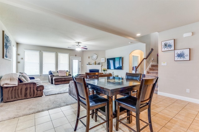 dining room featuring light tile patterned floors and ceiling fan