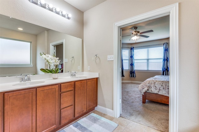 bathroom featuring tile patterned floors, ceiling fan, and vanity